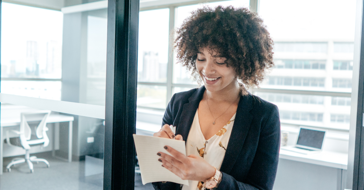 Person checking off items on a year-end-fundraising campaign checklist