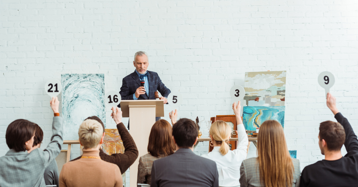 Event attendees participate in a live auction as one of many fundraising activities.