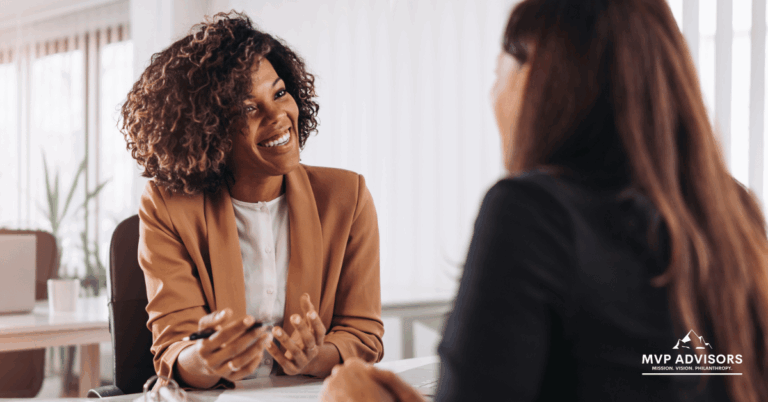 How hiring nonprofit consultants can look - Two business women hold a one-on-one meeting