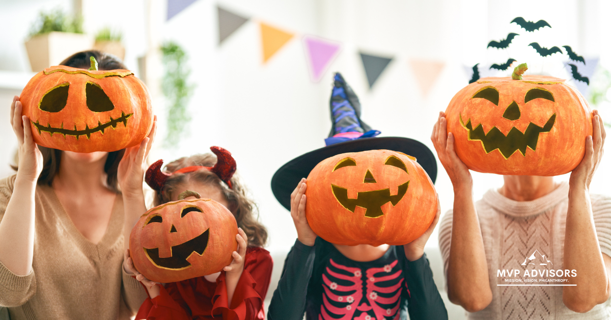 Blog header image for Fall Fundraising Ideas blog shows a family holding carved pumpkins in front of their faces