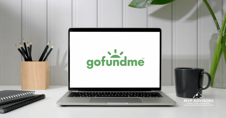 Blog header image featuring an open laptop showcasing the GoFundMe logo