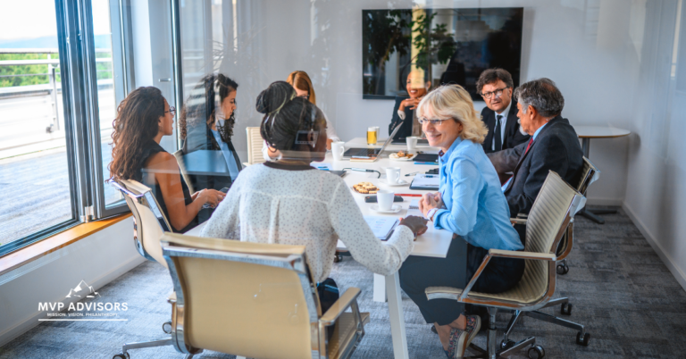 Blog header image showing nonprofit board members gathered for a meeting